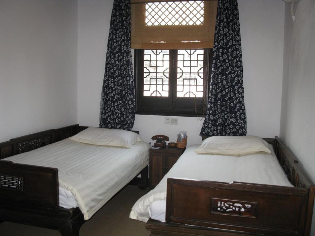 XI Di Travel Lodge Yi (Anhui) Quarto foto